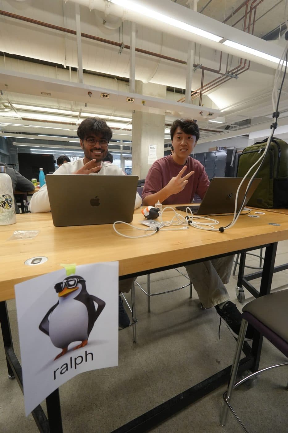Two builders at their table during the build night