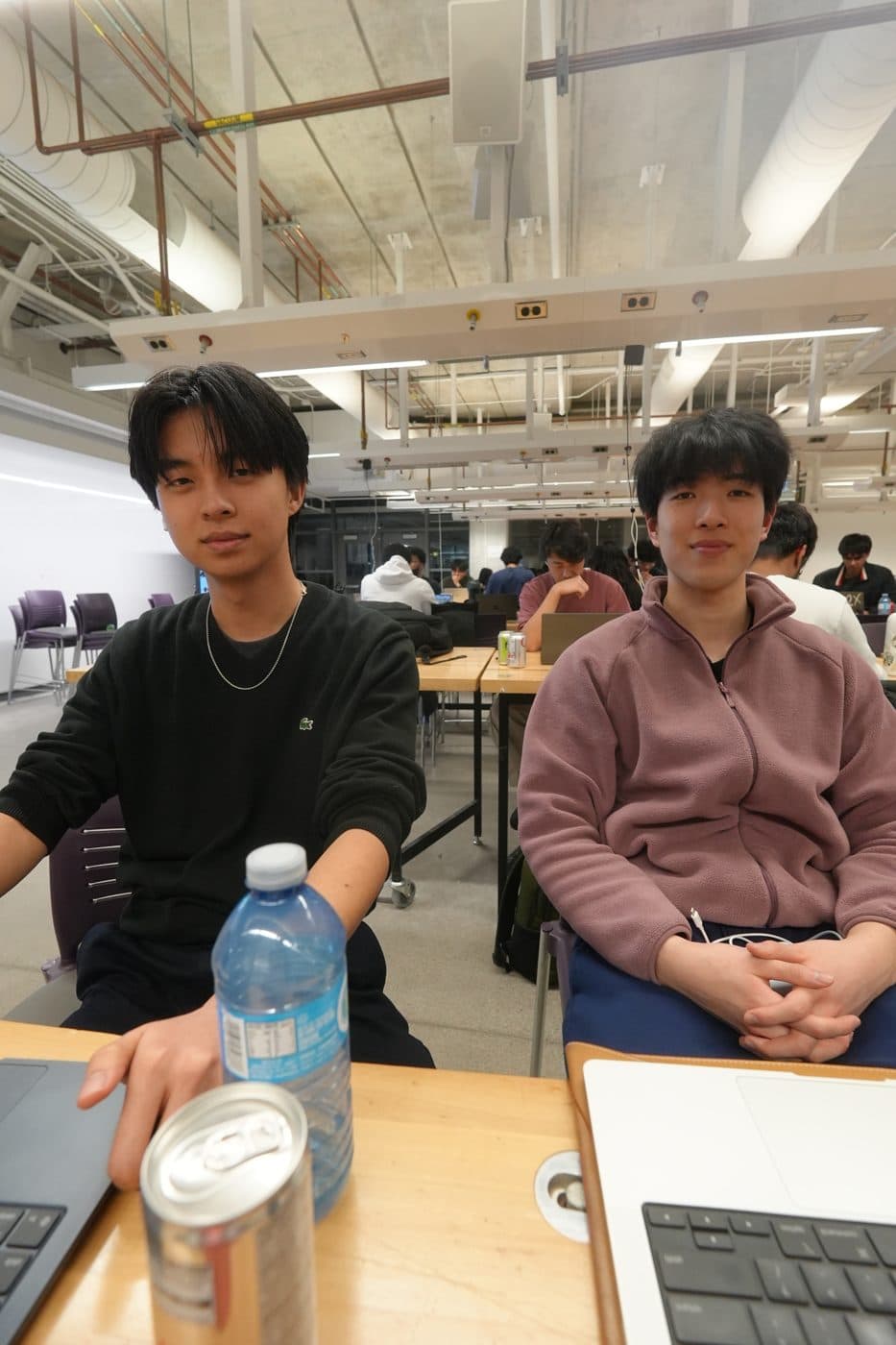 Two builders at a table during Freeform